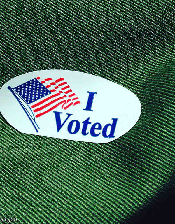 Voting sticker on green fabric