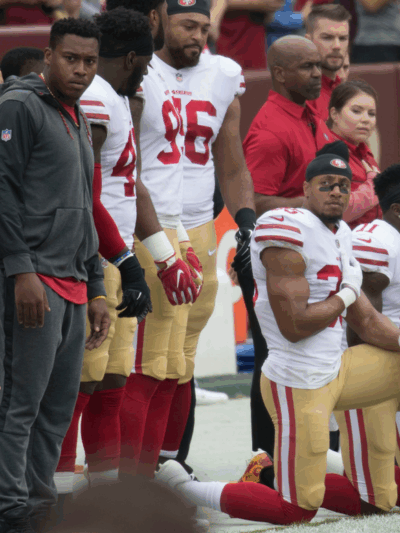 Some members of the San Francisco 49ers kneel during the National Anthem before a game against the Washington Redskins at FedEx Field on October 15, 2017 in Landover, Maryland.