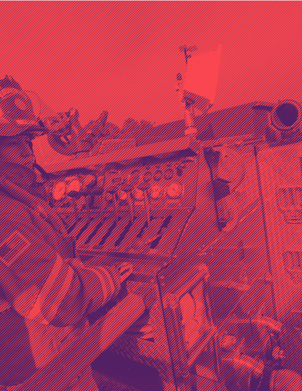 A woman fire fighter monitors the fire hose control system