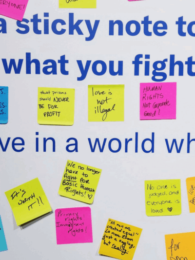 A picture of a wall full of sticky notes about what people fight for, from the ACLU Membership Conference