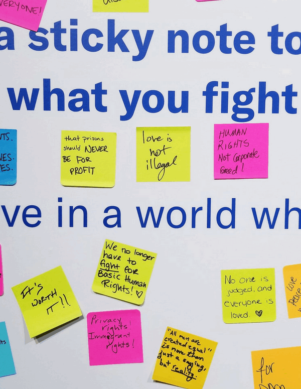A picture of a wall full of sticky notes about what people fight for, from the ACLU Membership Conference