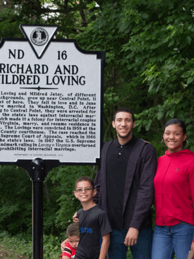 The Lovings' family standing in front of the historic marker dedicated to them.