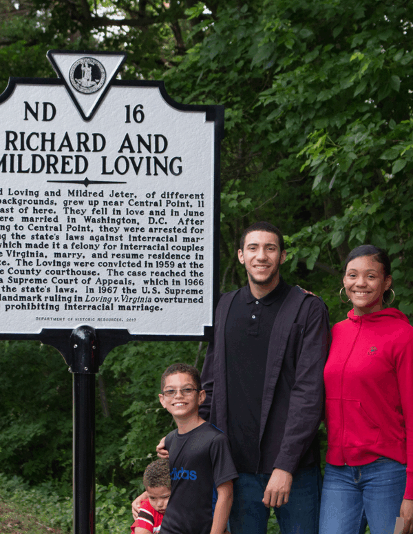 The Lovings' family standing in front of the historic marker dedicated to them.