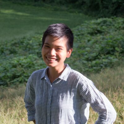 Profile picture of our Communications Associate Phuong Tran, Asian, with black short hair and a wide smile