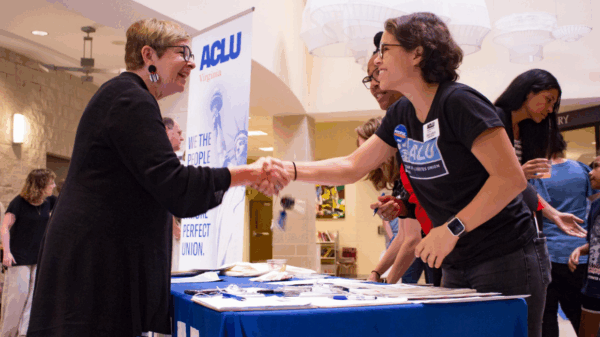 ACLUVA Office Assistant Zhue shook hand with guests at our annual meeting