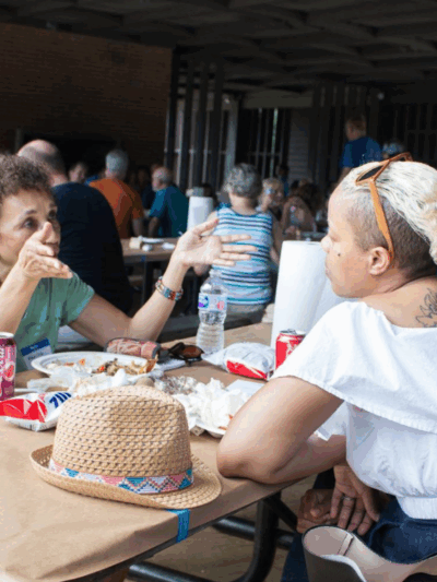 Two black women talking over food at the 2018 Northern Virginia Chapter's Annual Meeting and CrabFest