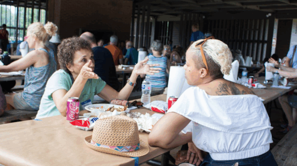 Two black women talking over food at the 2018 Northern Virginia Chapter's Annual Meeting and CrabFest
