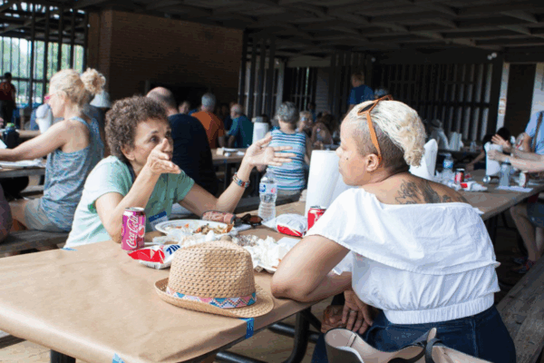 Two black women talking over food at the 2018 Northern Virginia Chapter's Annual Meeting and CrabFest