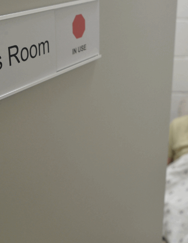 A mother breastfeeding her child in a specially designated "Mother's Room"
