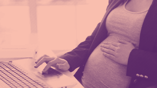 engraved photo of a pregnant woman working on a laptop