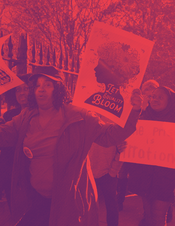 Protesters holding a sign that says "Let Equality Bloom"