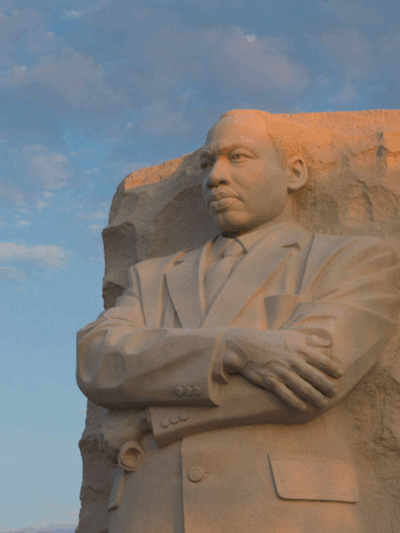 a statue of Dr. Martin Luther King Jr. in Washington DC at sunset