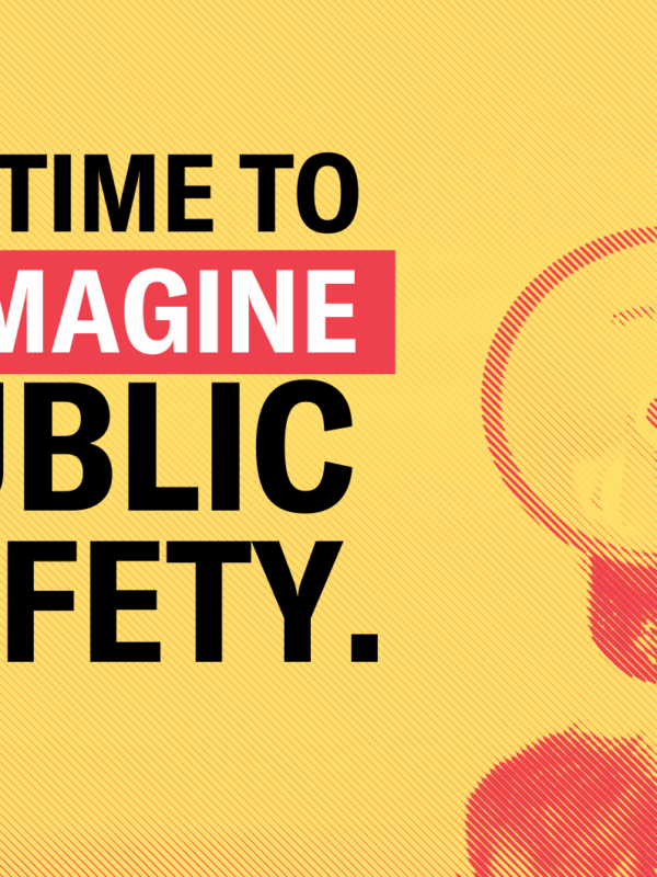 bright yellow background with the text "it's time to reimagine public safety" on the right corner there's an image of a megaphone raised up in the air