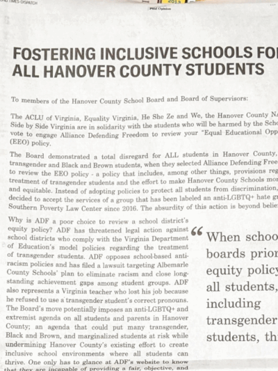 Fostering inclusive schools for all Hanover County students," with a bookshelf in the background and  stuffed animals to the right and left of the newspapers.
