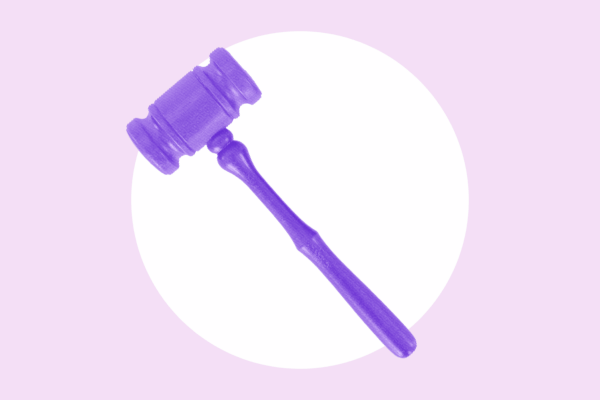 Over a light purple background is a bright purple gavel.