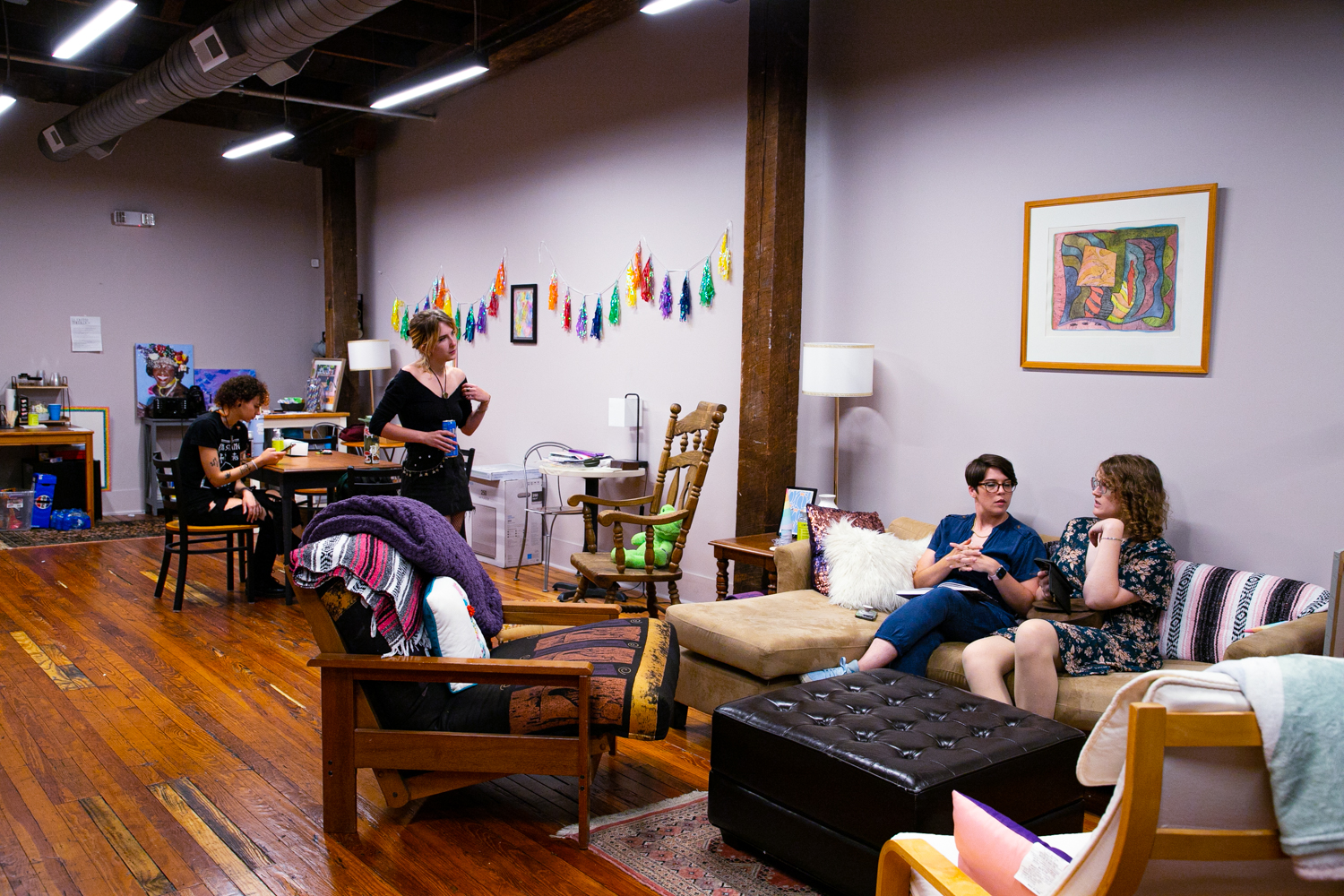 Ellenor Zinski sat next to her partner on the couch at Lavender Lodge, a queer space in Lynchburg.