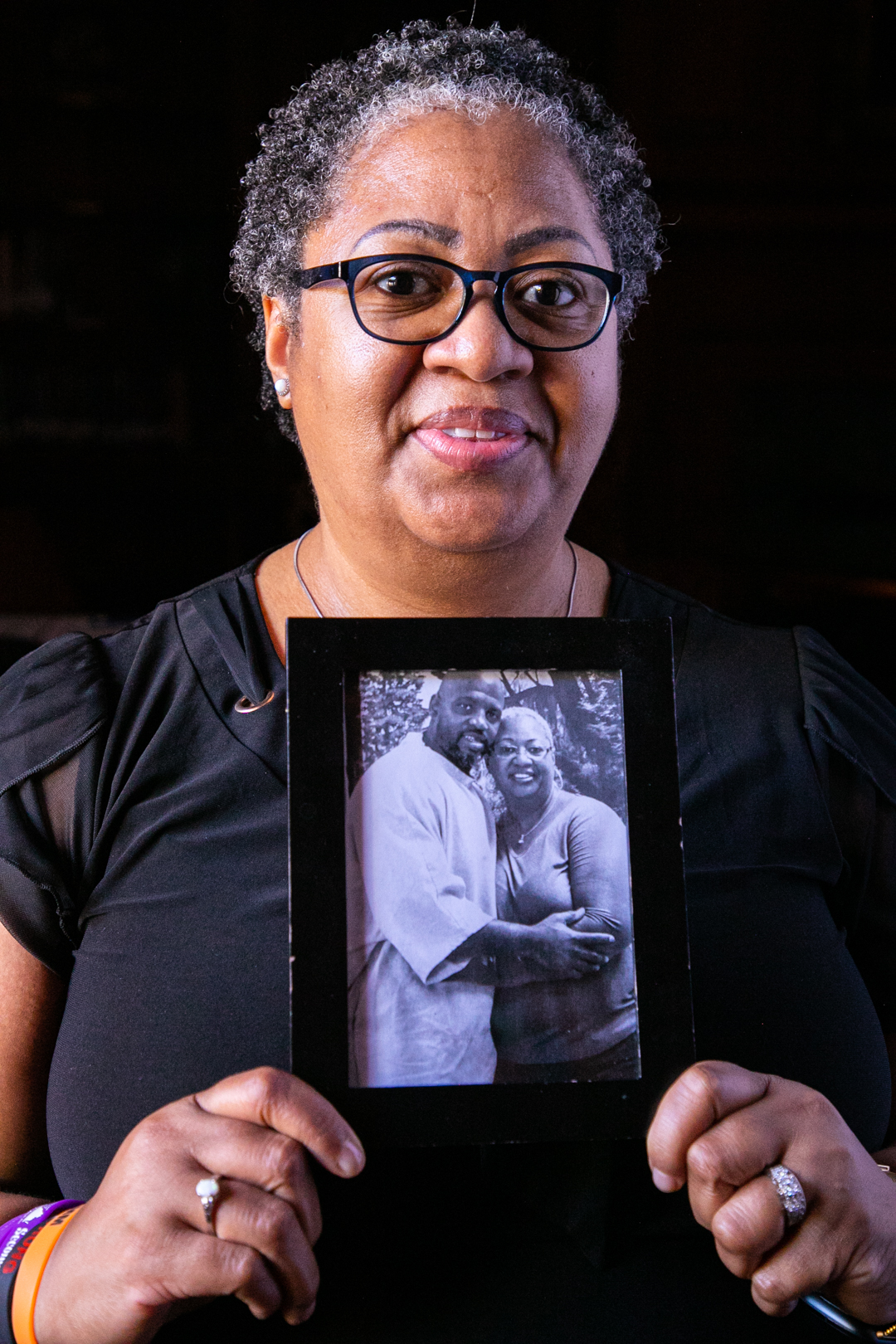 Paulettra holds a photo of her and her husband Jerry during a prison visit
