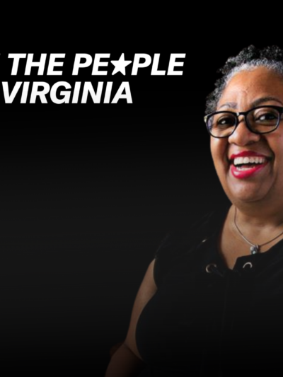 A Black woman is seen smiling towards a camera. She is seen wearing glasses and having short curly hair. She wears a black shirt and pink lipstick. To the left of her is ACLU of Virginia's logo and the text, "We the people of Virginia."