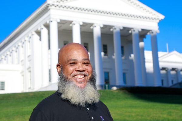 Tati smiles ear to ear with the Virginia Capitol in the background