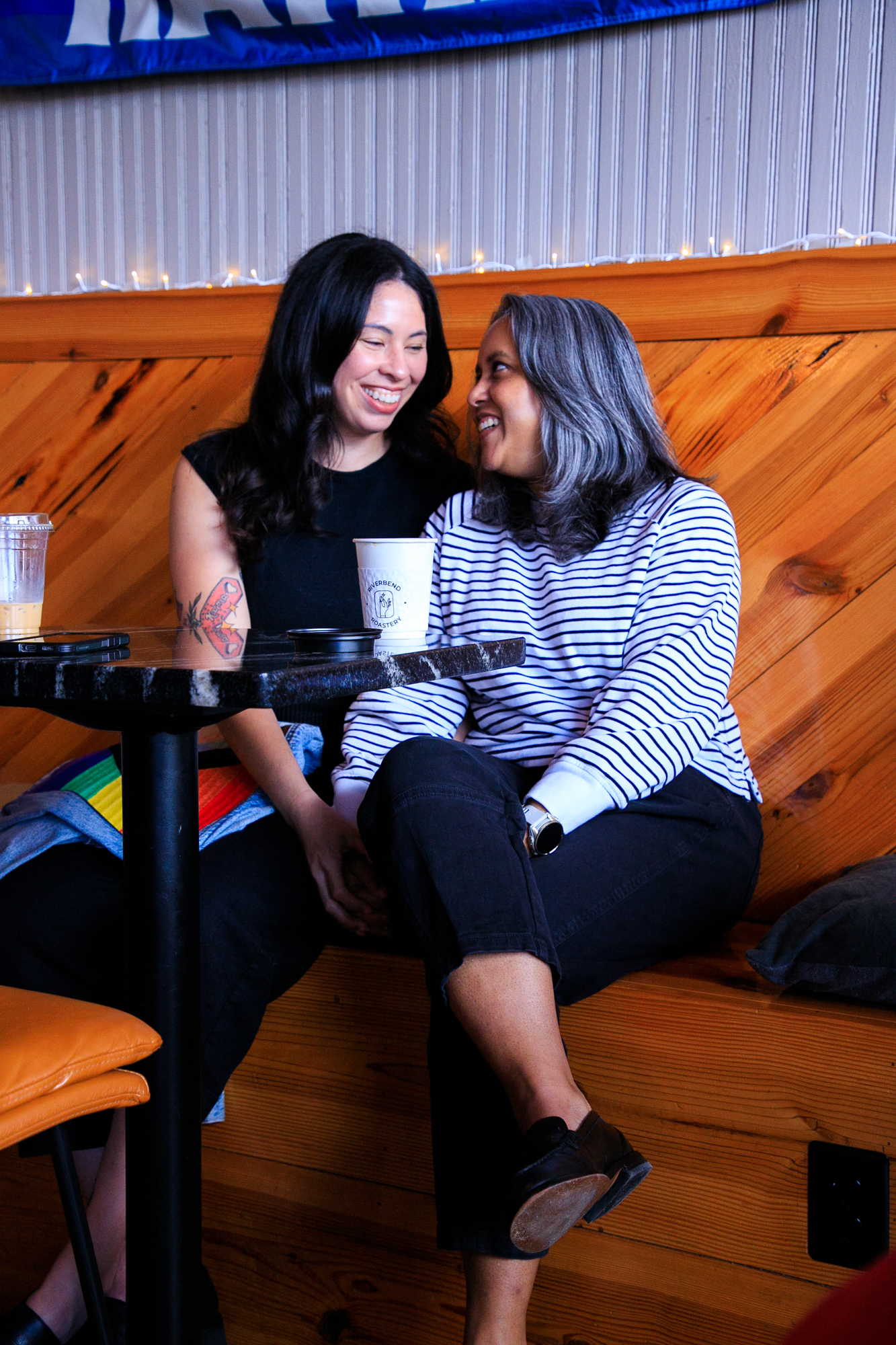 Bre and Narissa look at each other and smile with joy