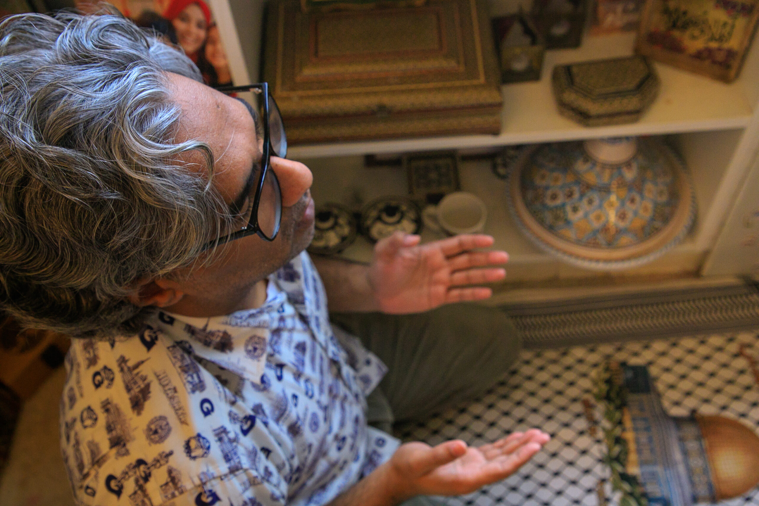 Badar prays in his living room
