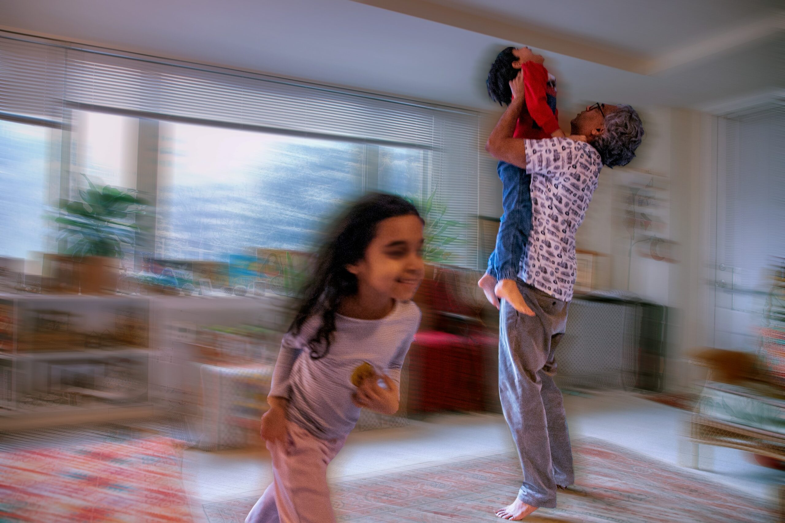 Badar plays with his kids after they come home from school
