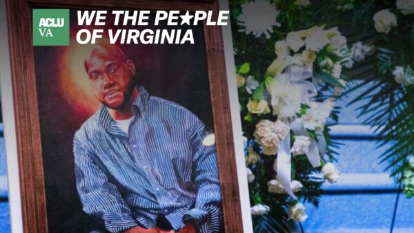 A painting of a black man is stood next to a bouquet of white flowers.