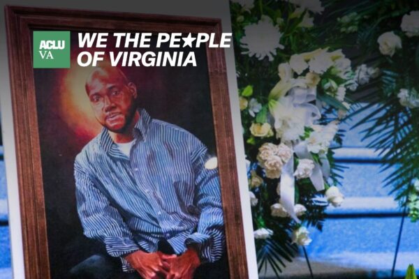 A painting of a black man is stood next to a bouquet of white flowers.