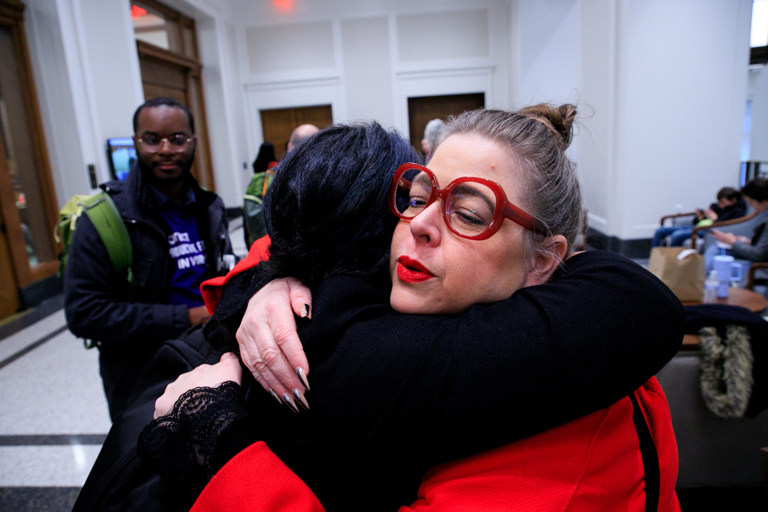 Heather hugs another organizer after sharing her abortion story
