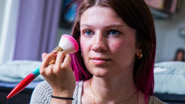 Eliza putting on make up