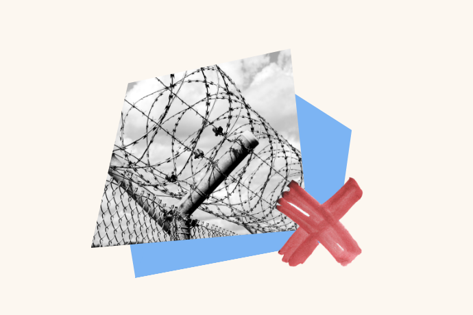 A photo of a prison wall is overlapped with an X.