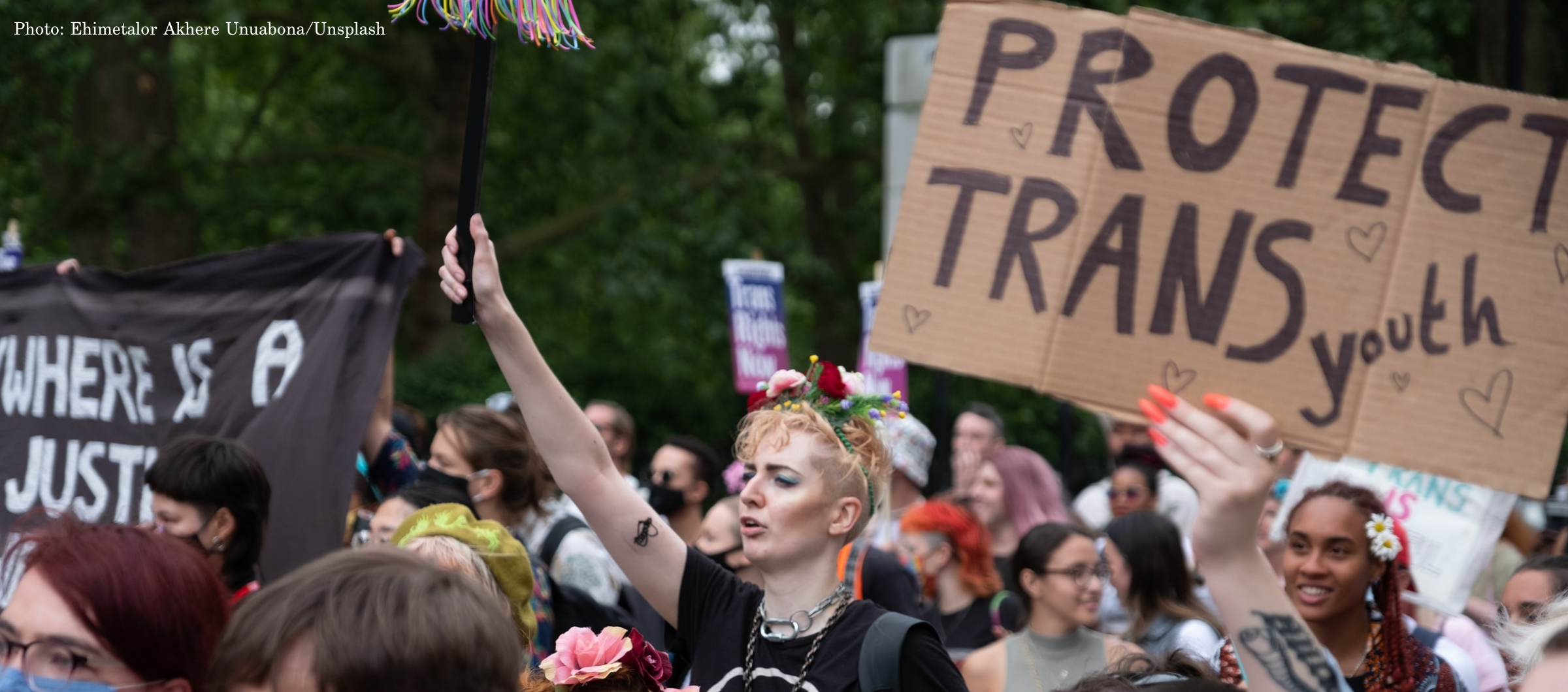 A photo of people protesting in support of trans students