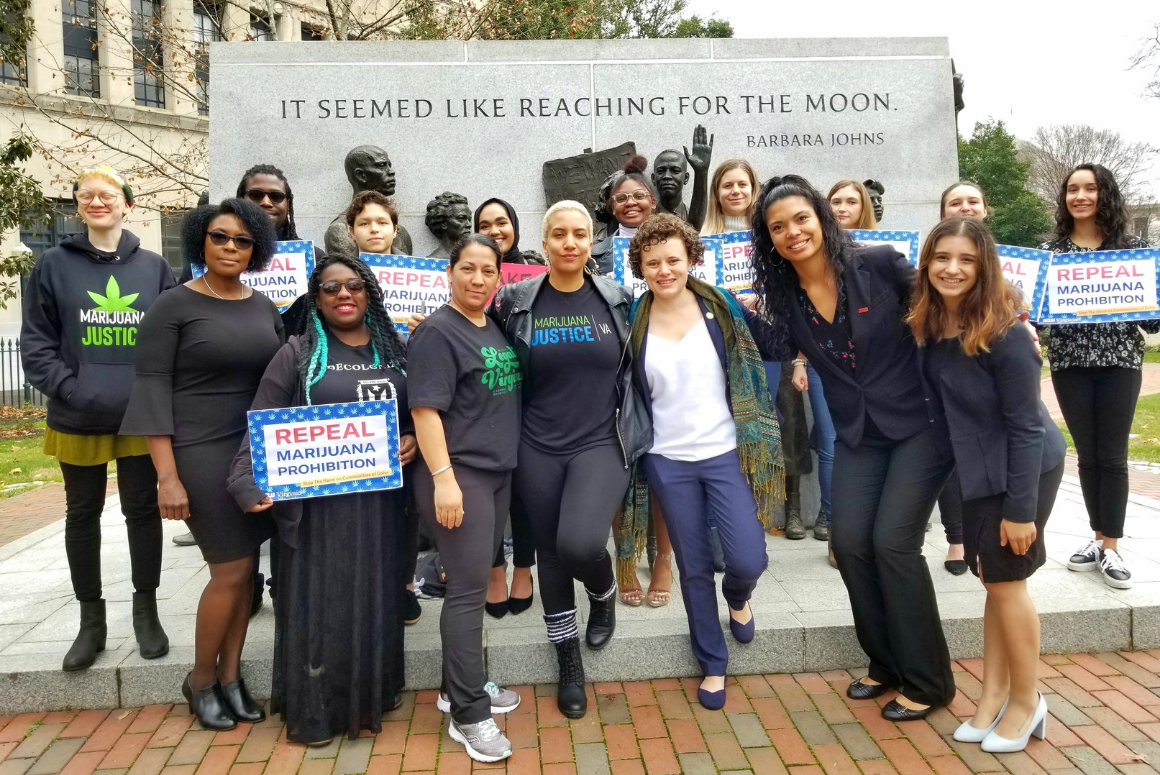 Group of advocates posing in front of Barbara Johns statue
