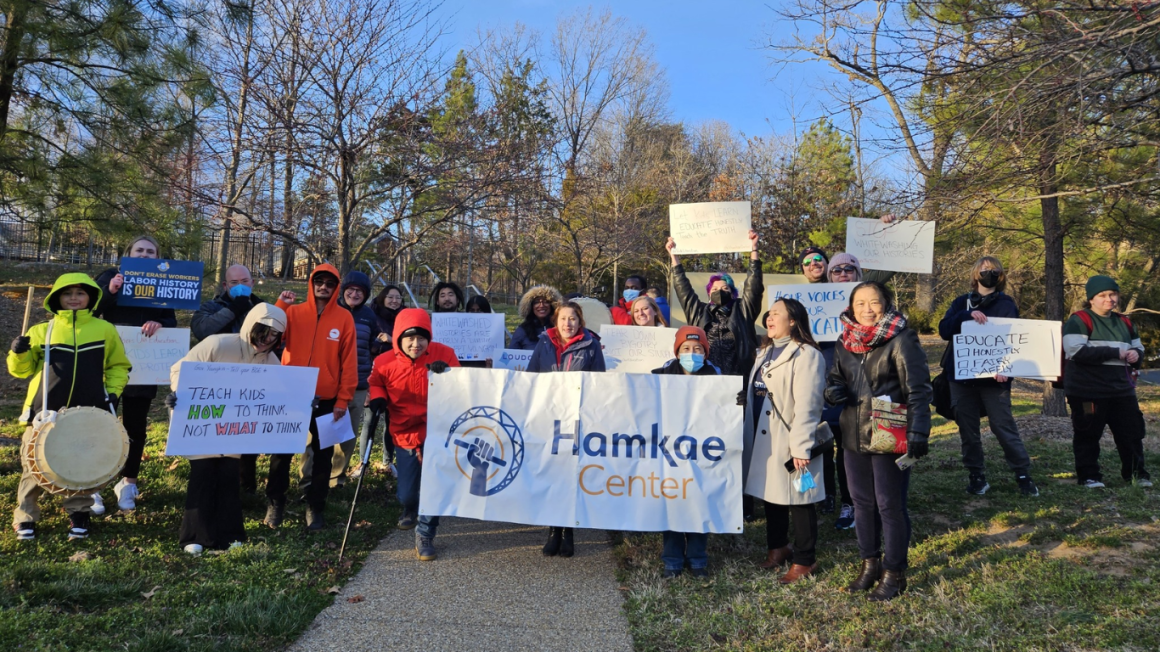 Members of Hamkae Center held a banner with "Hamkae Center" logo and other protest signs against censorship