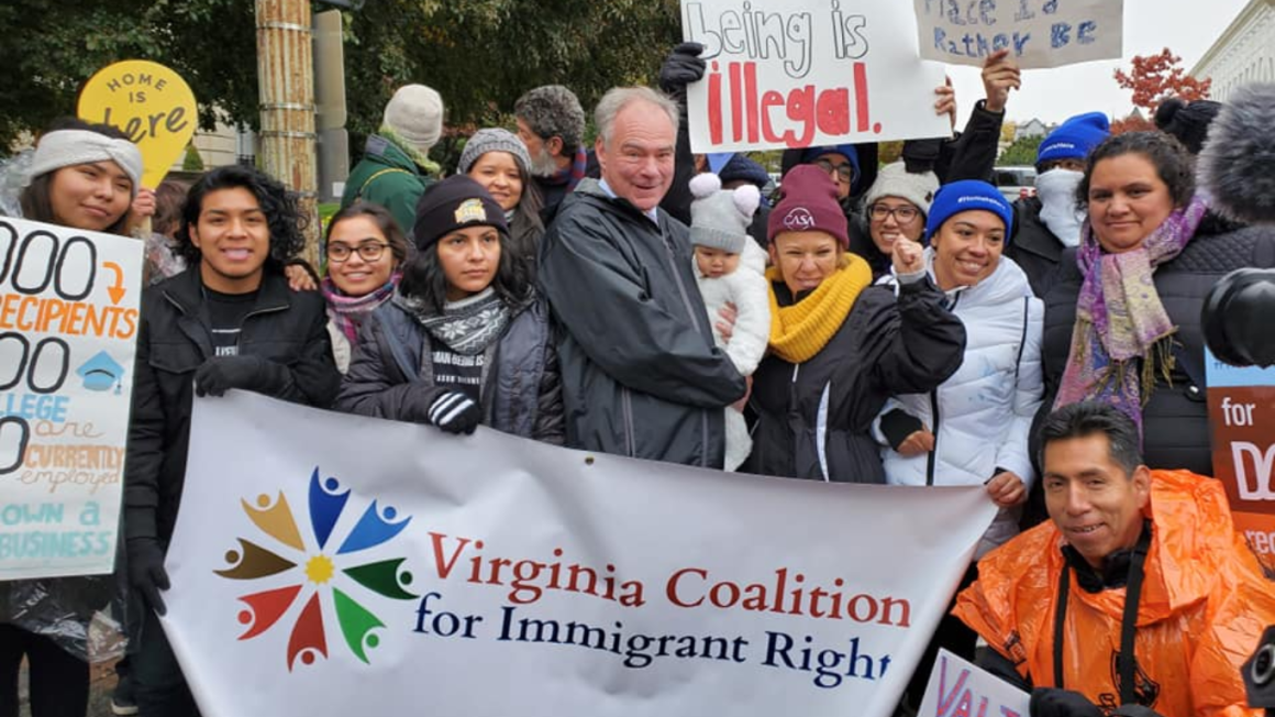 Members of VACIR held protest signs such as "no human being is illegal" and the Virginia Coalition for Immigrant Rights banner