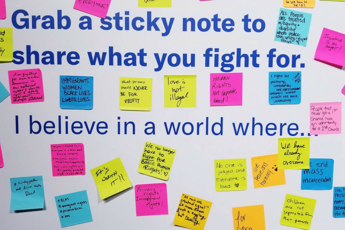 A picture of a wall full of sticky notes about what people fight for, from the ACLU Membership Conference