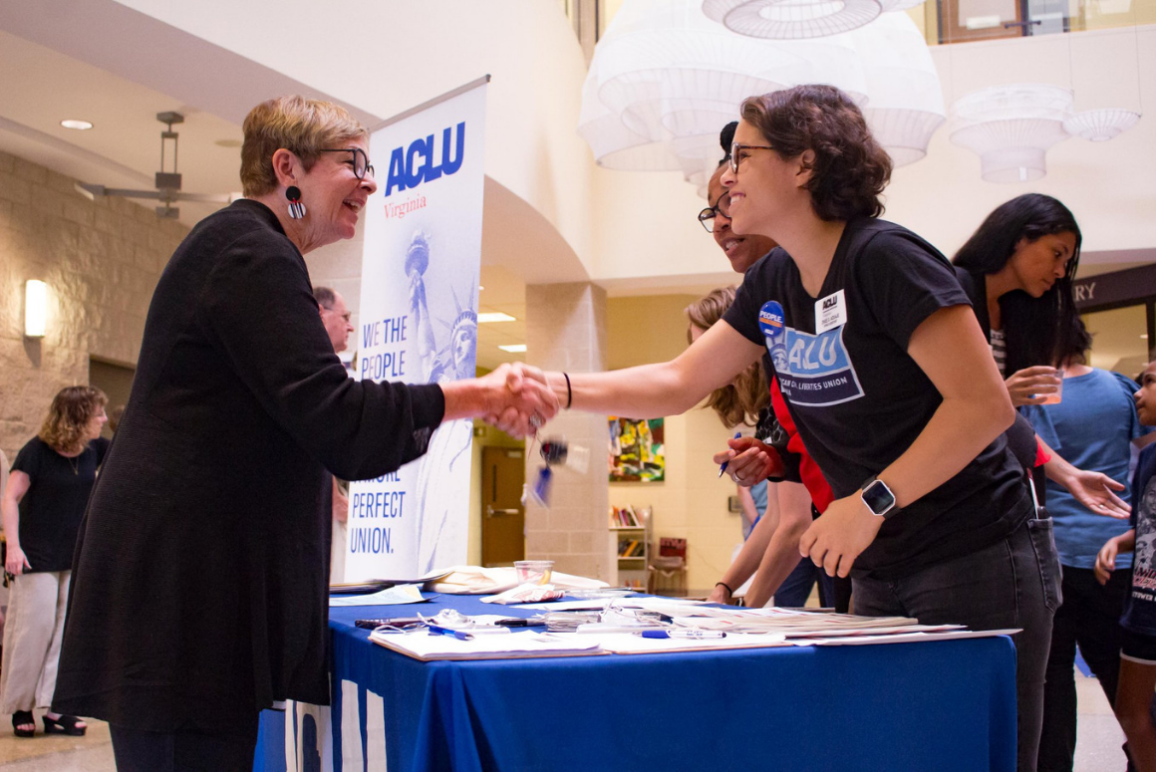 ACLUVA Office Assistant Zhue shook hand with guests at our annual meeting