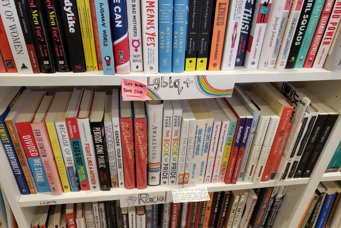 book shelves full of diverse titles that include stories about LGBTQ+ people, racial justice, and much more.