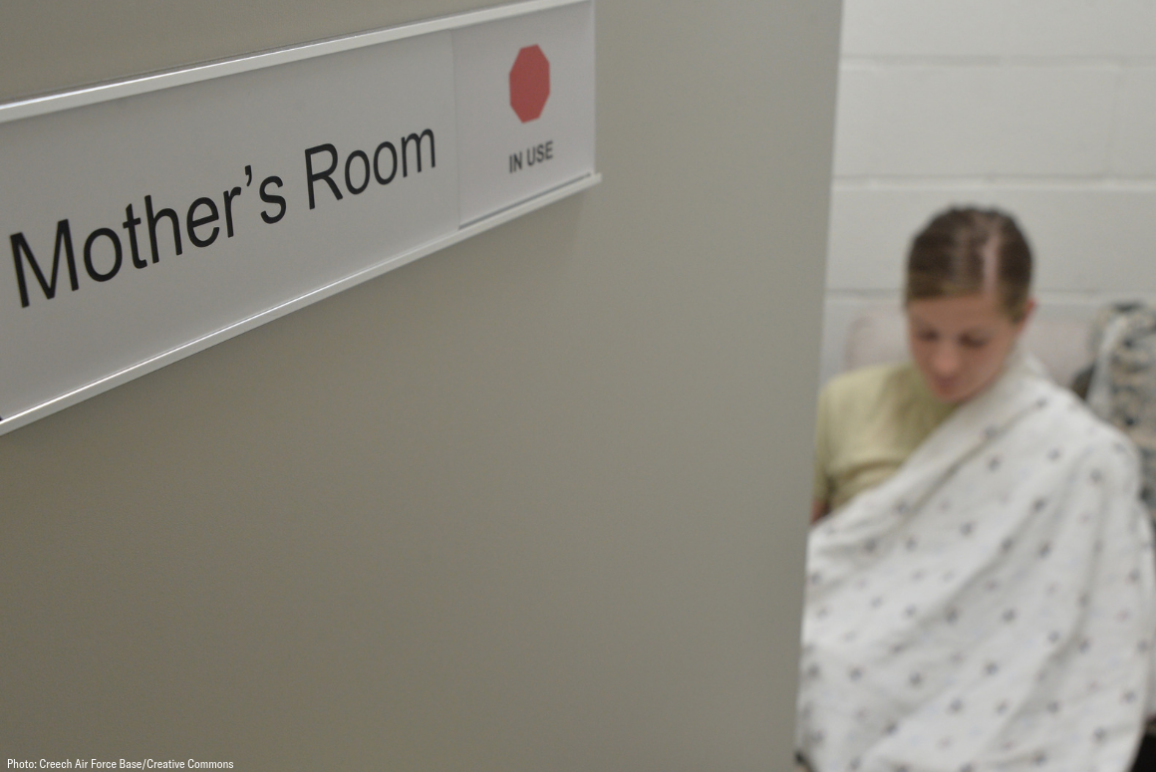 A mother breastfeeding her child in a specially designated "Mother's Room"
