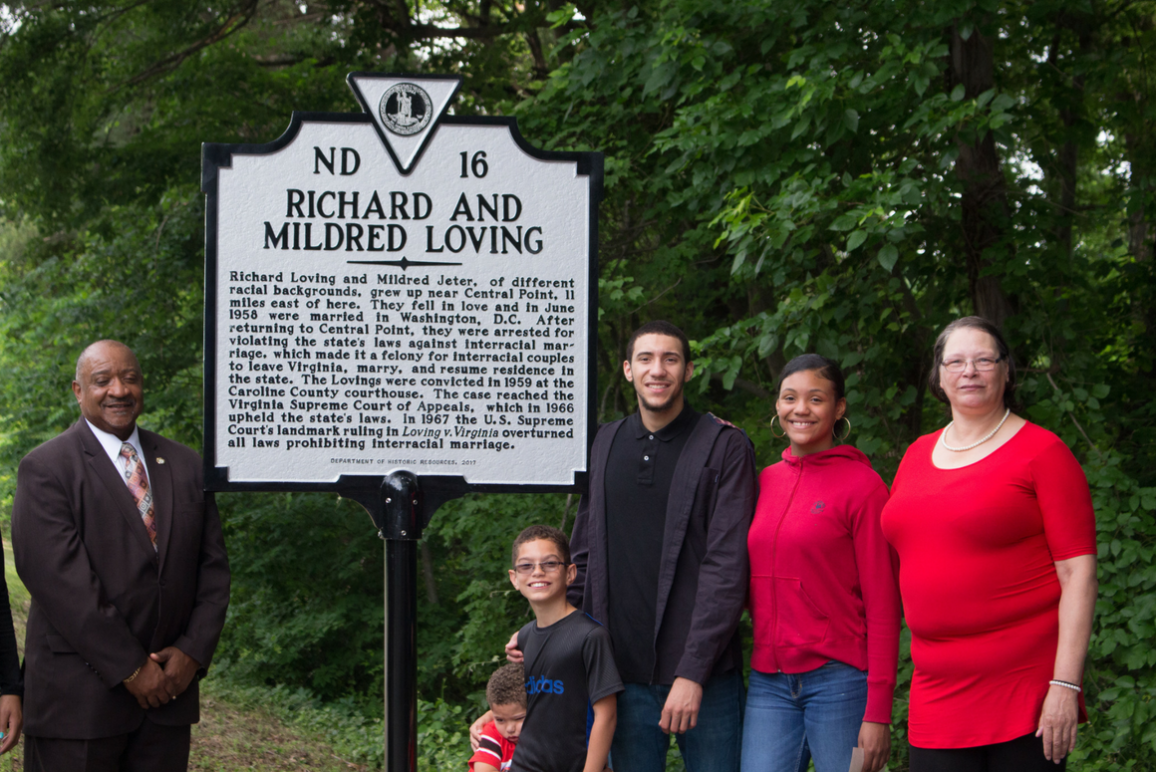 The Lovings' family standing in front of the historic marker dedicated to them.