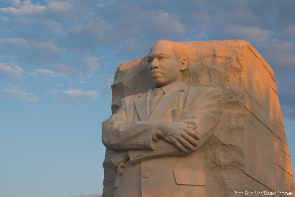 a statue of Dr. Martin Luther King Jr. in Washington DC at sunset