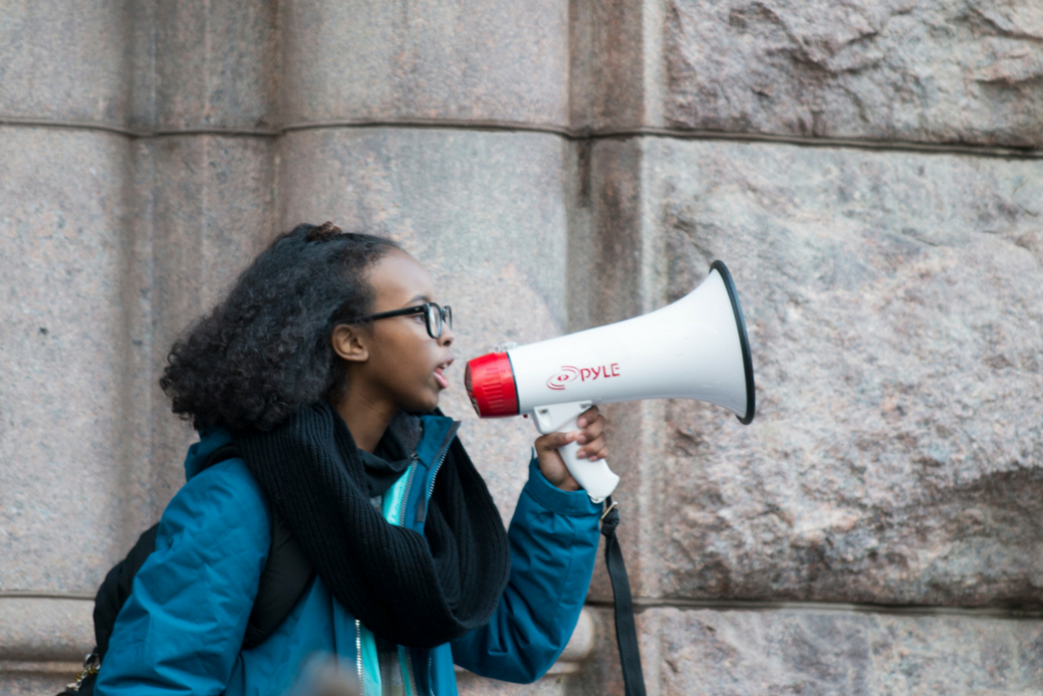 A student holding a pa speaker