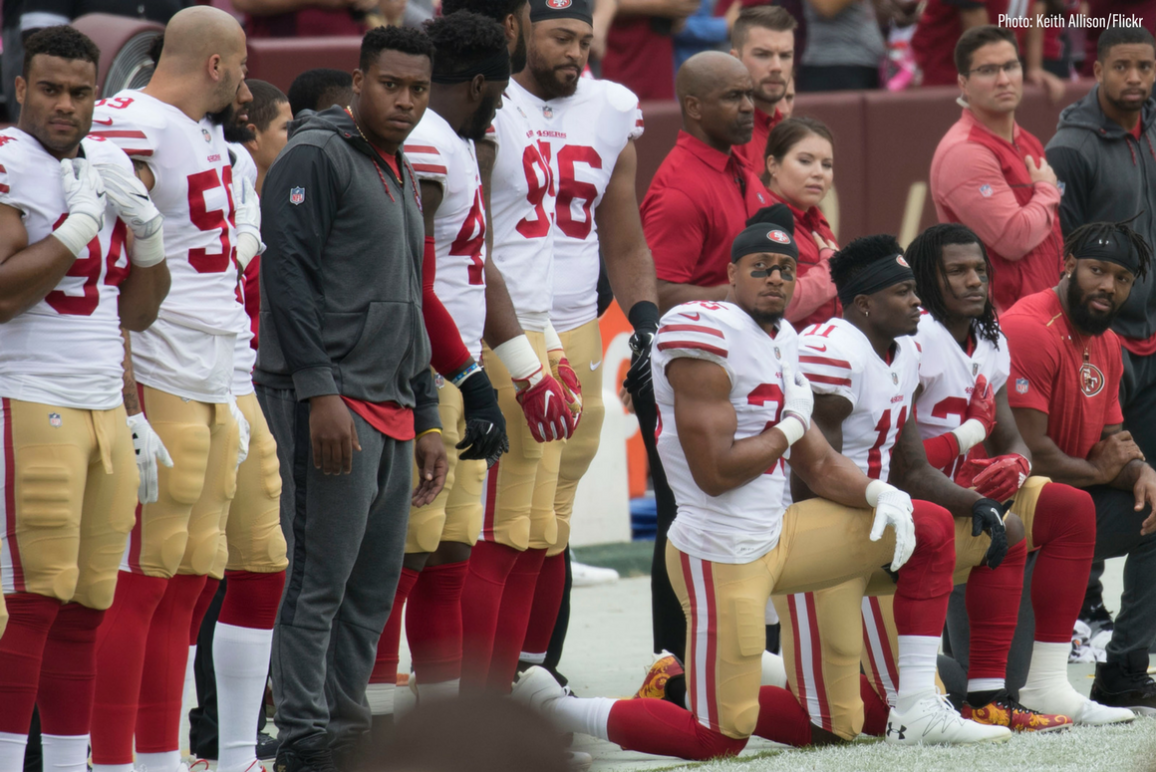 Some members of the San Francisco 49ers kneel during the National Anthem before a game against the Washington Redskins at FedEx Field on October 15, 2017 in Landover, Maryland.