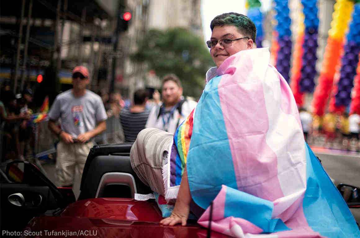 Gavin Grimm wearing the trans flag at NYC Pride