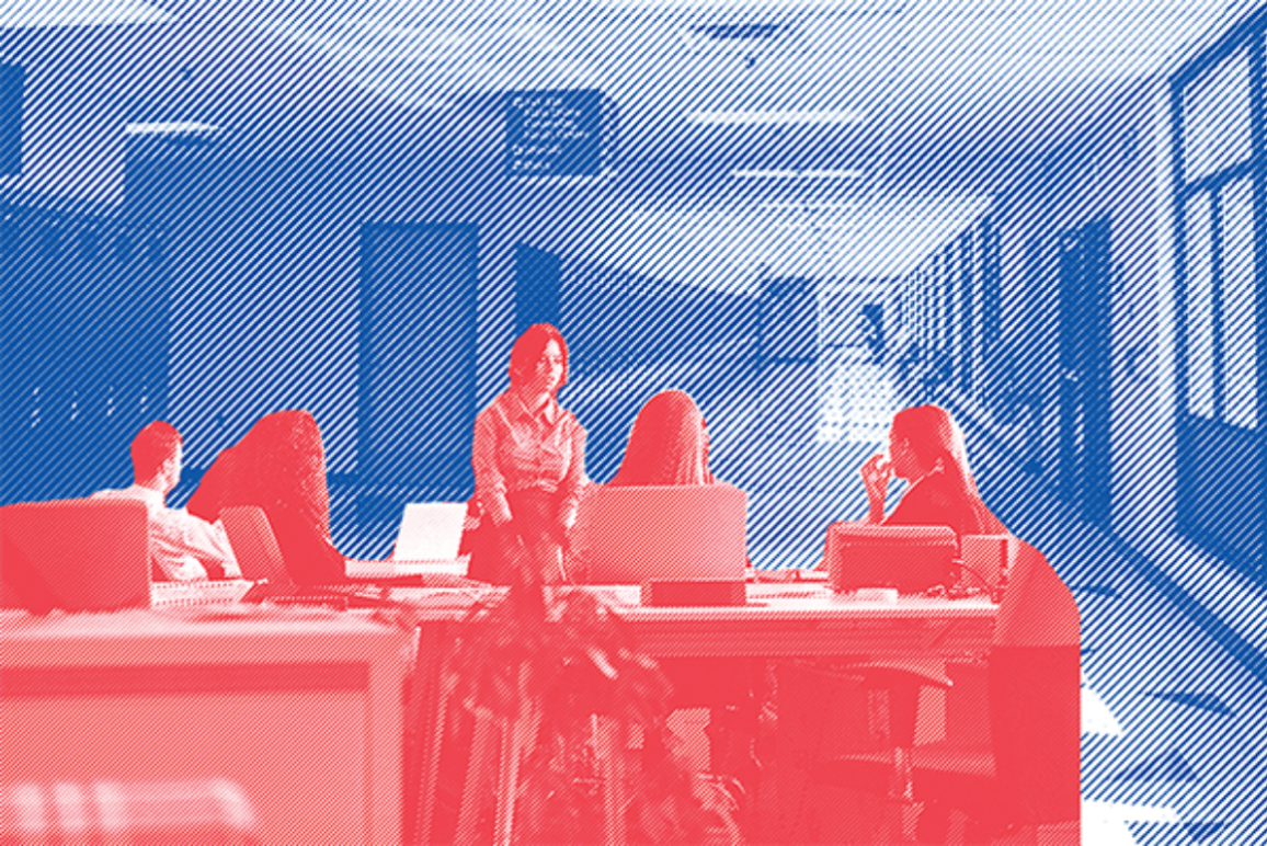 stock photo of an office with people sitting at their desks