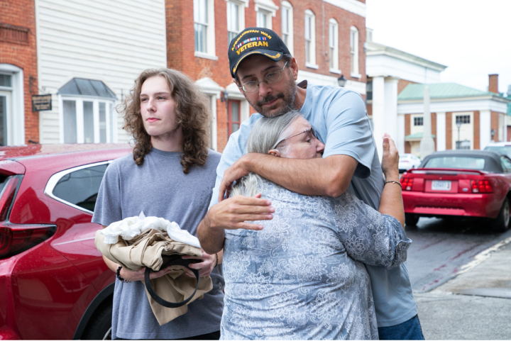 Steven Prease hugged his mom right after he was released from prison with his son holding his prison clothes standing nearby.