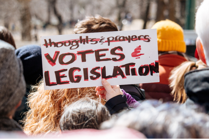 photo of a protest sign that says "thoughts & prayers (crossed-off) votes & legislation"