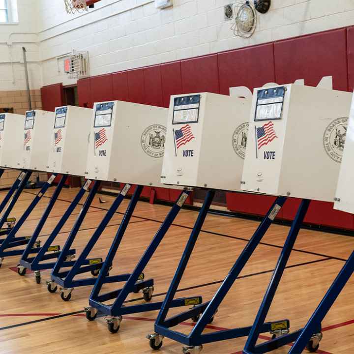 Voting booths lined up at polling station during in a public school in Brooklyn, New York.