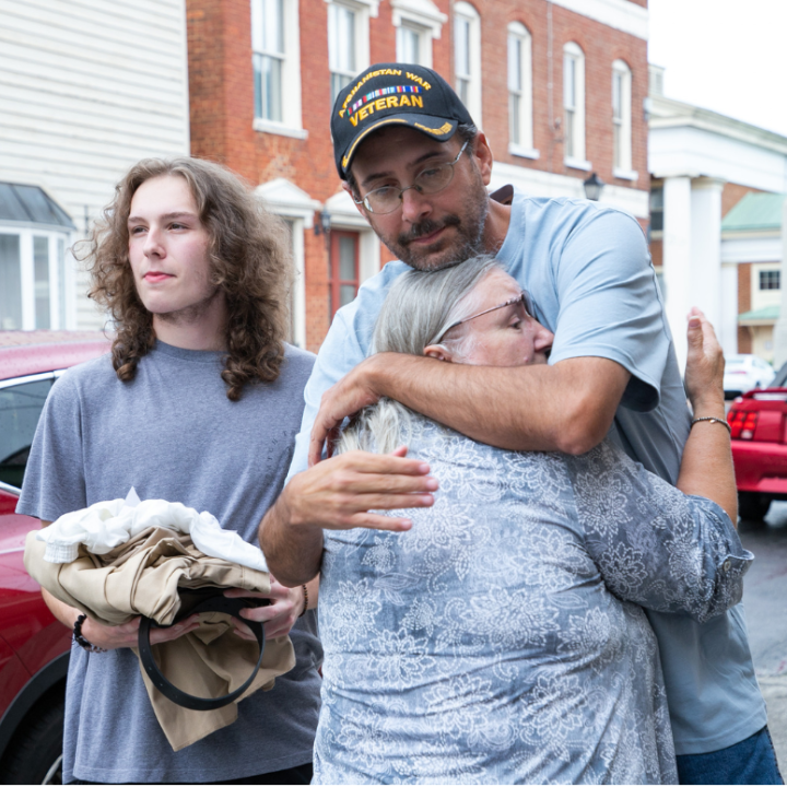 Steven Prease hugged his mom right after he was released from prison with his son holding his prison clothes standing nearby.