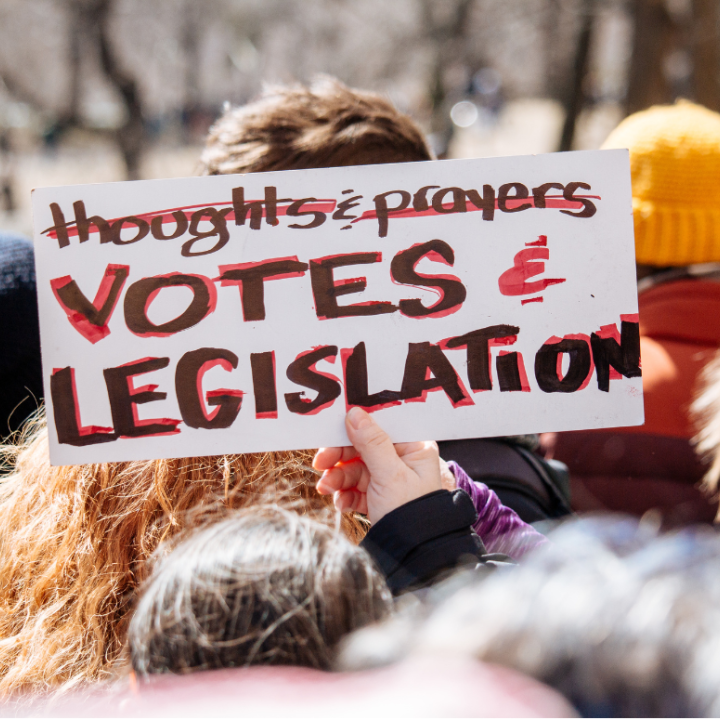photo of a protest sign that says "thoughts & prayers (crossed-off) votes & legislation"